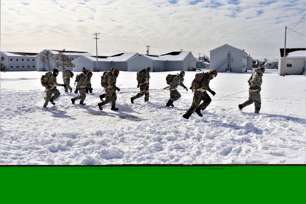 Fort McCoy CWOC Class 20-04 students practice pulling ahkio sled as a squad