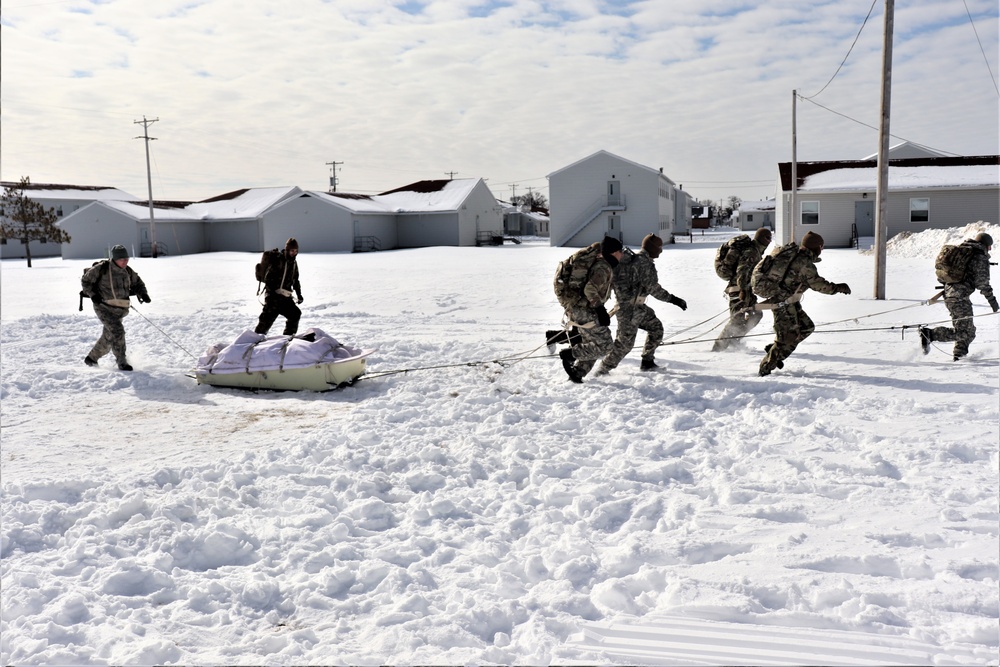 Fort McCoy CWOC Class 20-04 students practice pulling ahkio sled as a squad