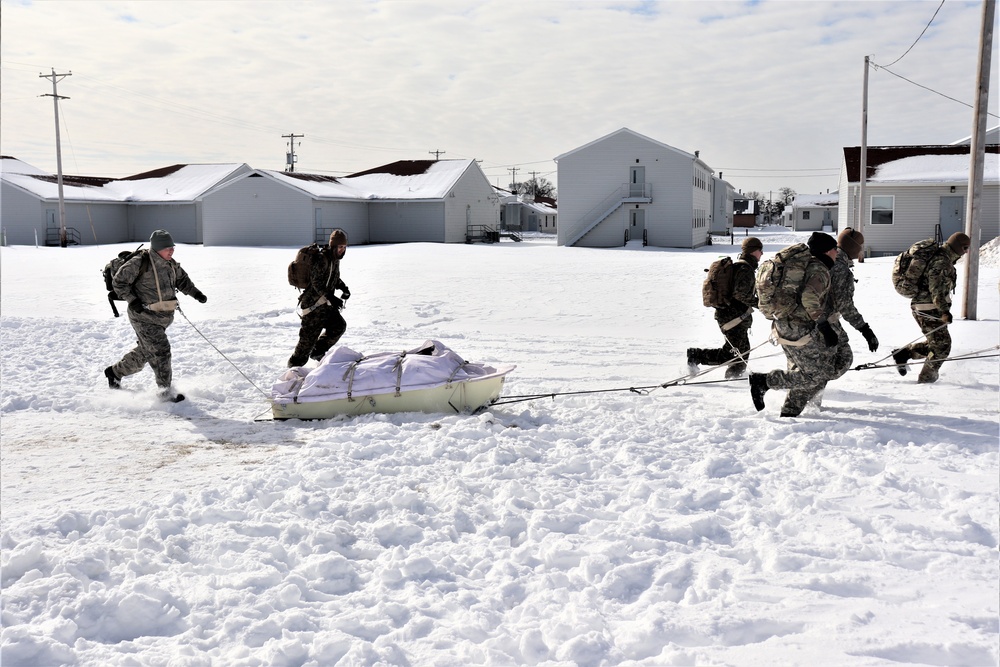 Fort McCoy CWOC Class 20-04 students practice pulling ahkio sled as a squad