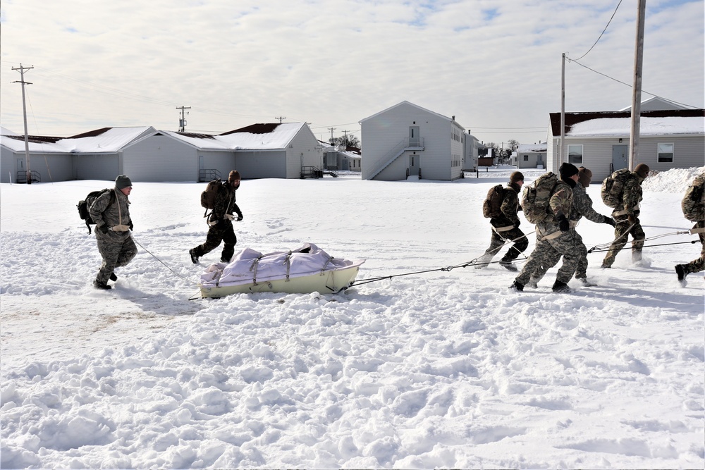 Fort McCoy CWOC Class 20-04 students practice pulling ahkio sled as a squad