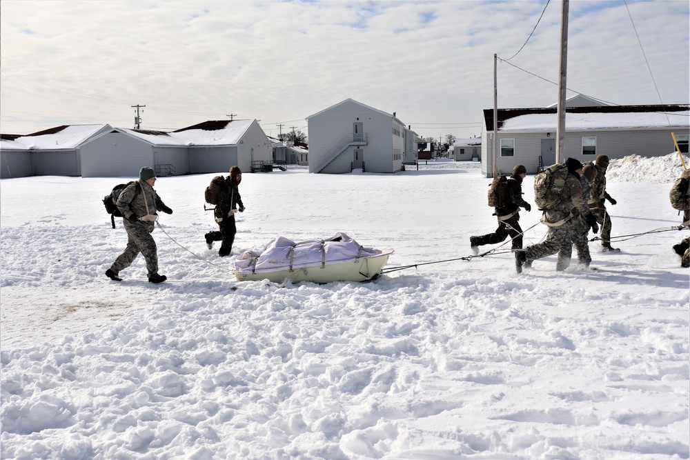 Fort McCoy CWOC Class 20-04 students practice pulling ahkio sled as a squad