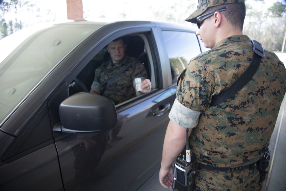 Camp Lejeune, MCAS New River gate sentries limit contact with identification cards at entry control points due to potential spread of COVID-19