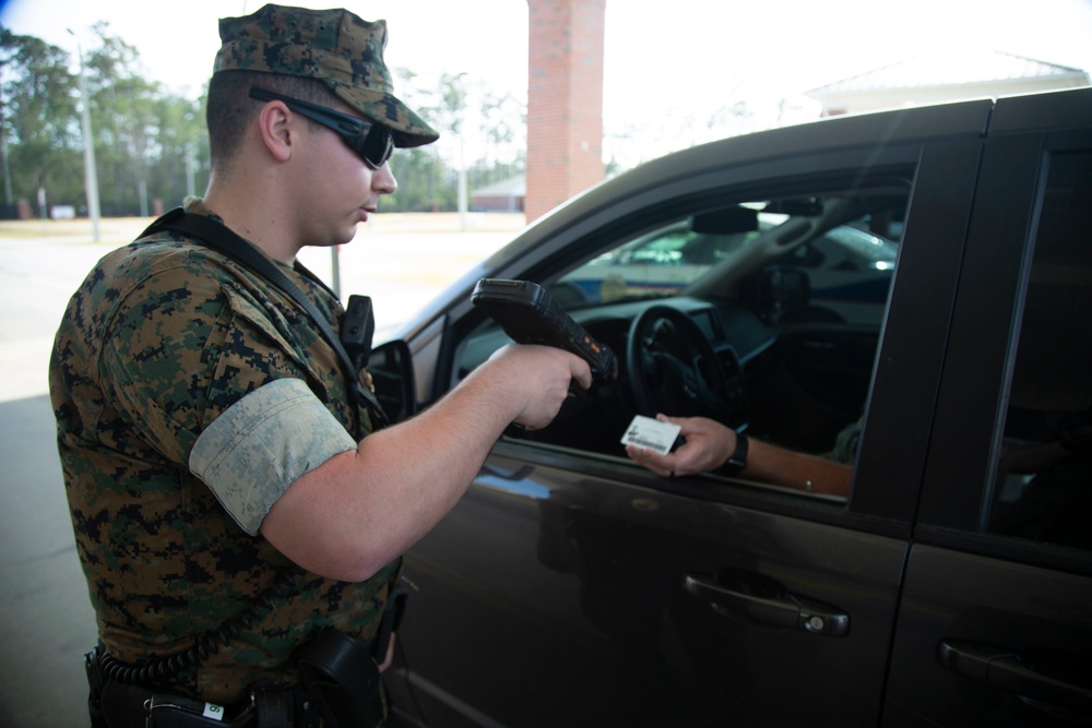 Camp Lejeune, MCAS New River gate sentries limit contact with identification cards at entry control points due to potential spread of COVID-19