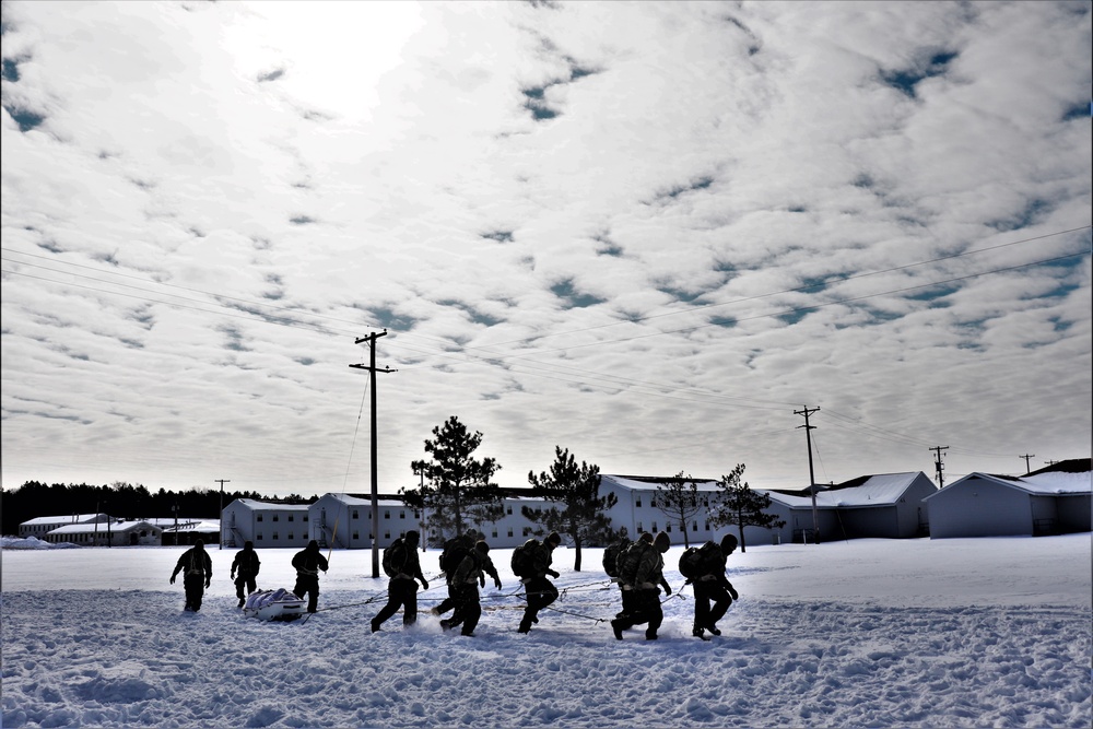 Fort McCoy CWOC Class 20-04 students practice pulling ahkio sled as a squad