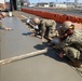 U.S. Navy Seabees with NMCB-5's Detail Atsugi construct a loading dock for the Navy Exchange