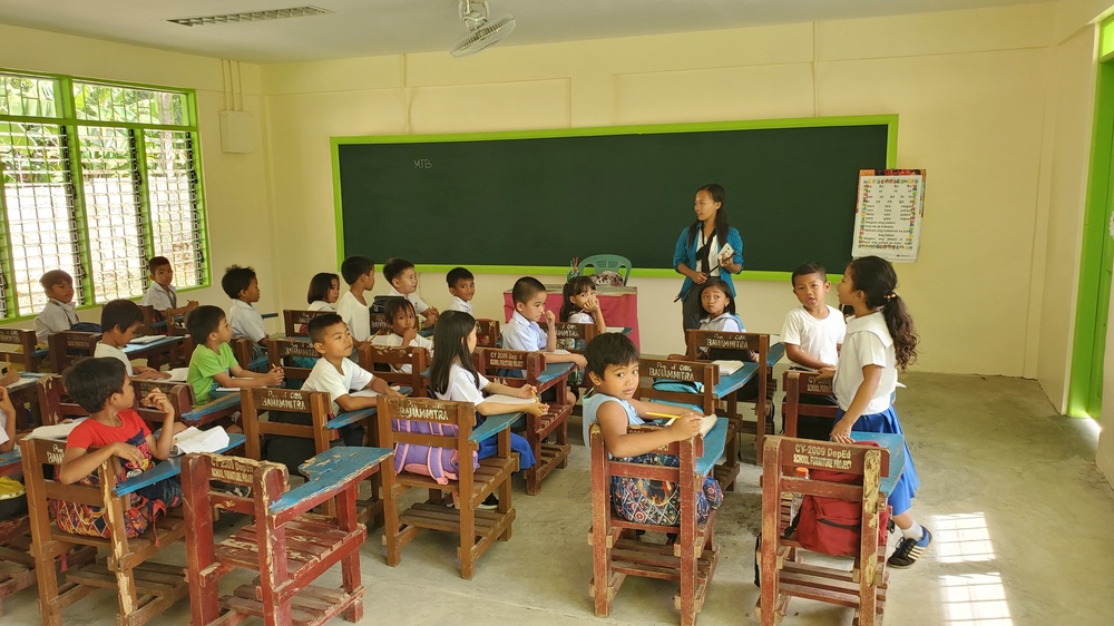 Local Palawan children in their new school built by U.S. Navy Seabees with NMCB-5