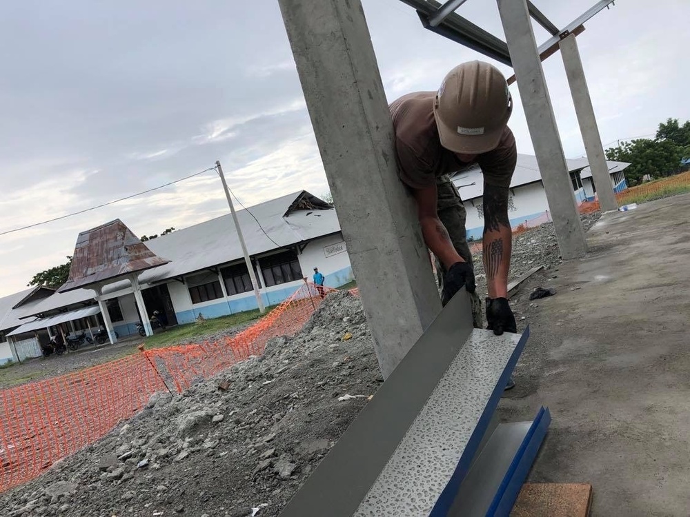 U.S. Navy Seabees with NMCB-5’s Detail Timor-Leste construct a two-room classroom