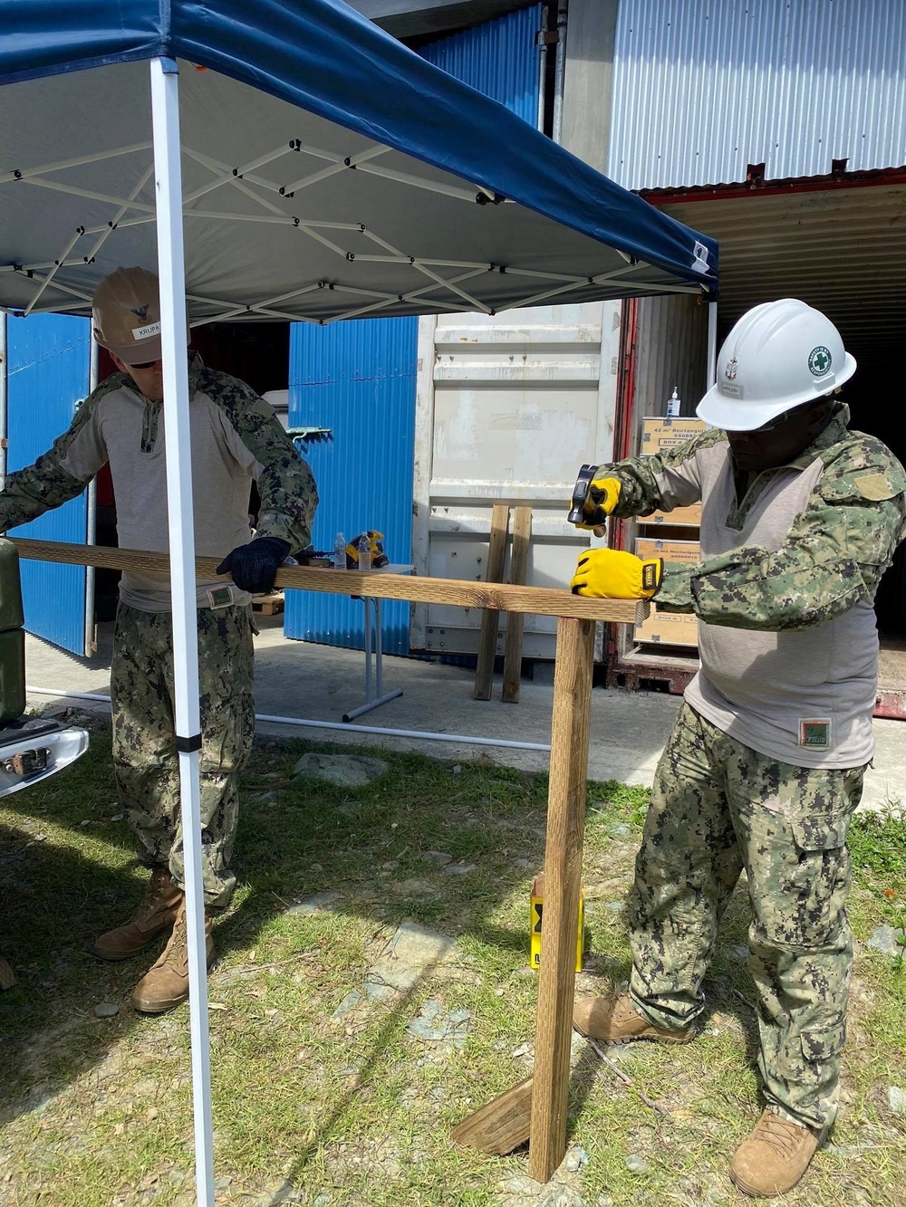 U.S. Navy Seabees with NMCB-5’s Detail Yap build hand-washing stations for a local school