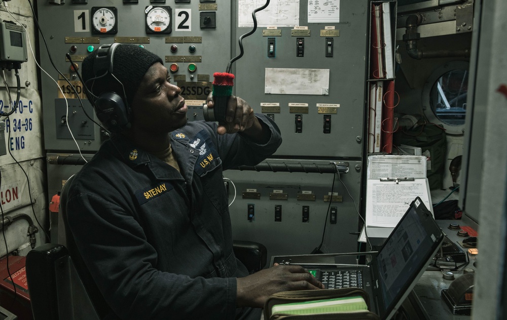 Chief Enginemen Josaphat Satenay conducts a daily engine check