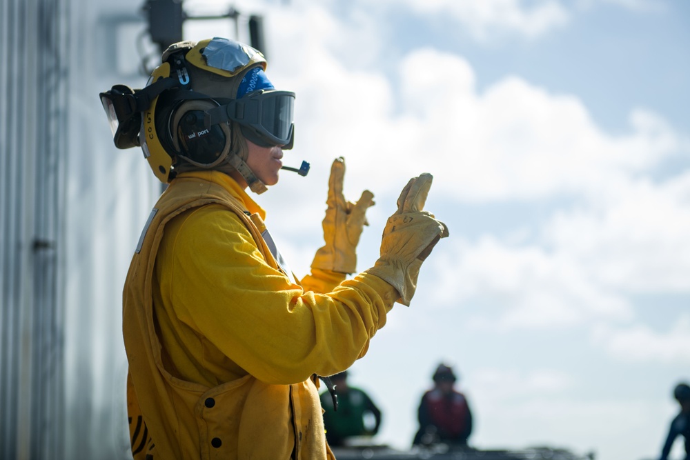 Sailor Signals On Flight Deck