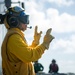 Sailor Signals On Flight Deck