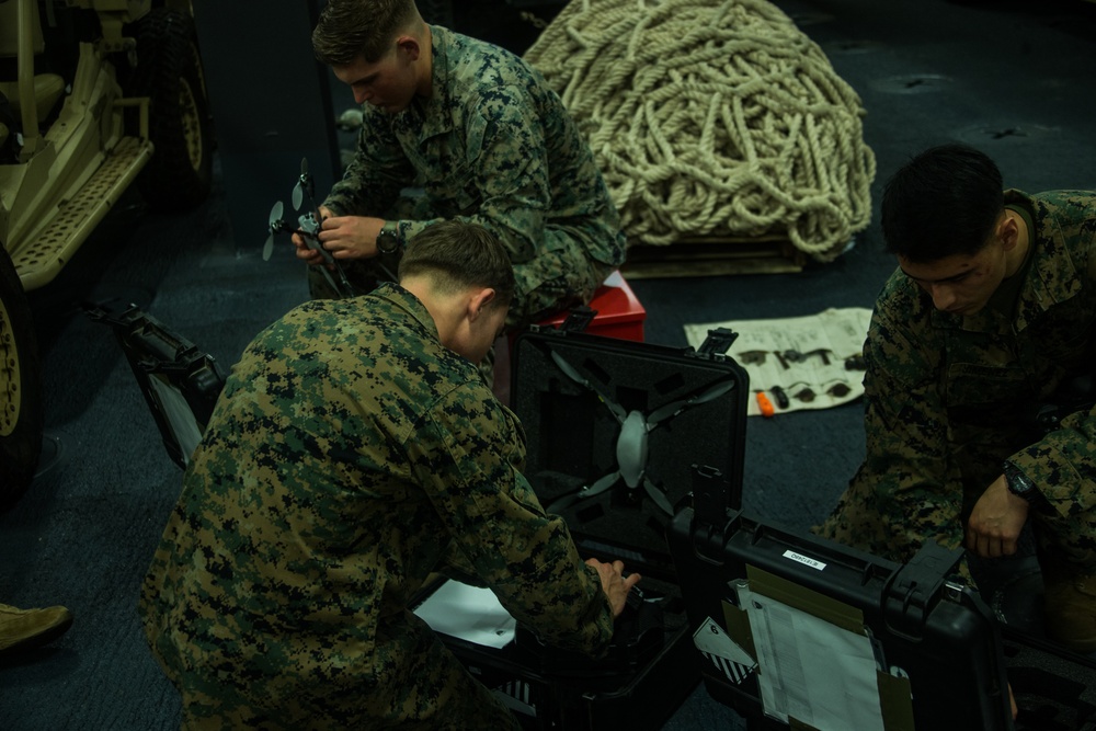 Marines with the 31st MEU conduct function checks on their Instant Eye drone system