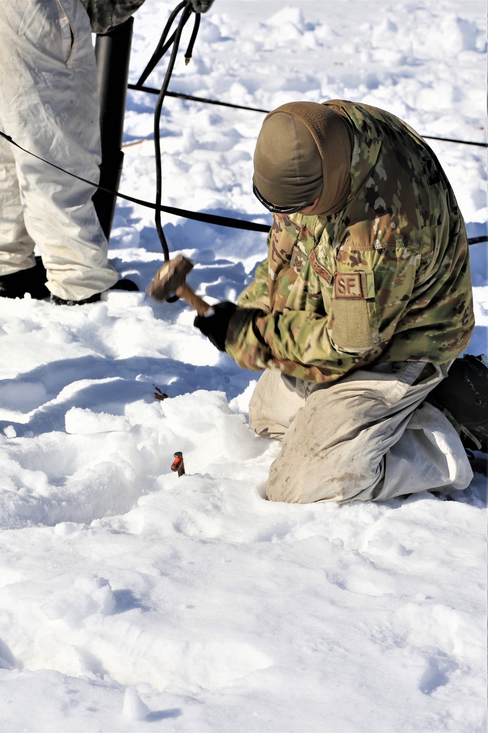 Cold-Weather Operations Course students practice building Arctic tent