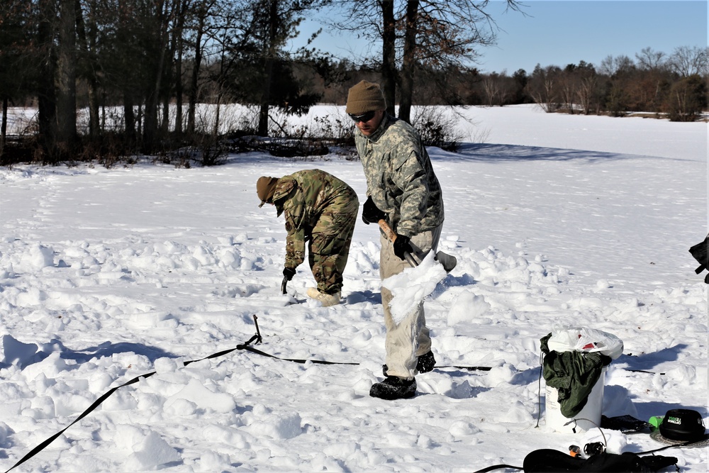 Cold-Weather Operations Course students practice building Arctic tent