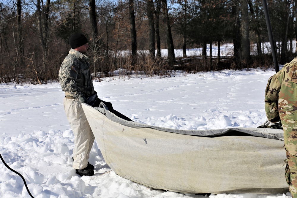 Cold-Weather Operations Course students practice building Arctic tent