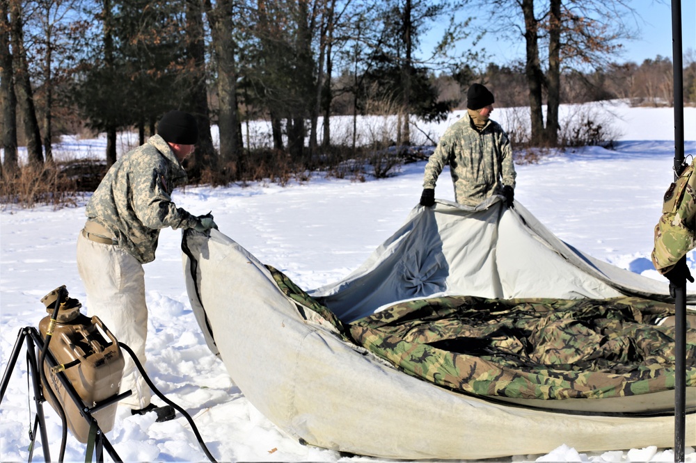 Cold-Weather Operations Course students practice building Arctic tent