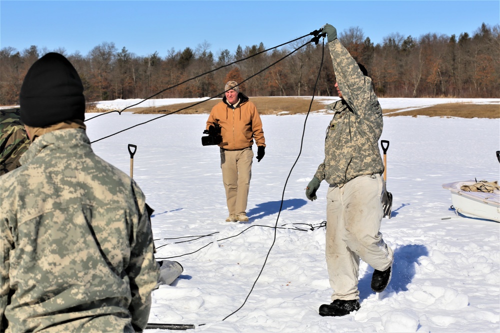 Cold-Weather Operations Course students practice building Arctic tent