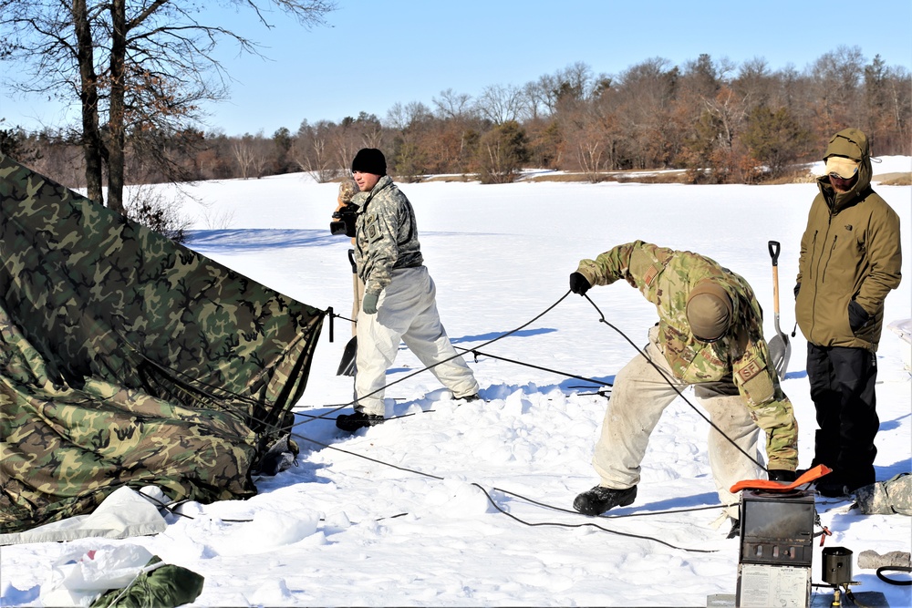 Cold-Weather Operations Course students practice building Arctic tent