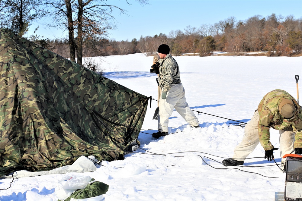 Cold-Weather Operations Course students practice building Arctic tent
