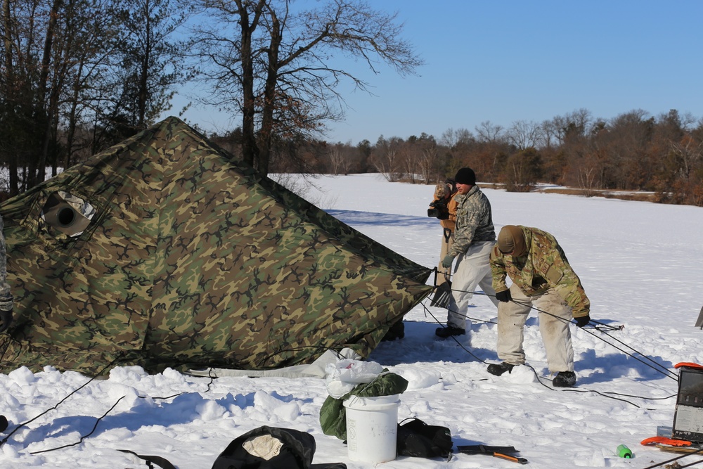 Cold-Weather Operations Course students practice building Arctic tent