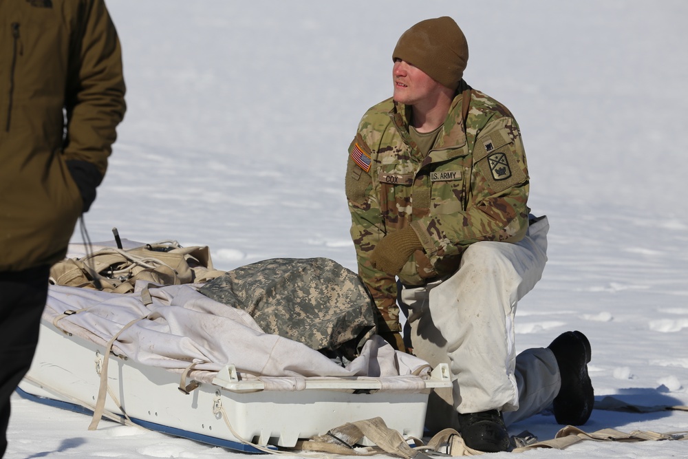 Cold-Weather Operations Course students practice building Arctic tent