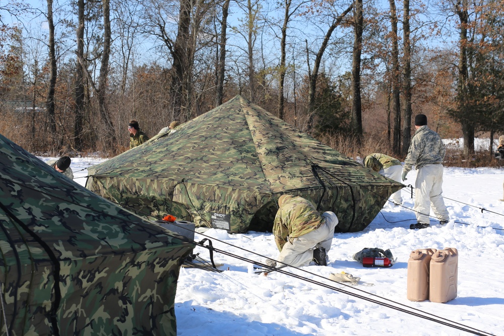 Cold-Weather Operations Course students practice building Arctic tent