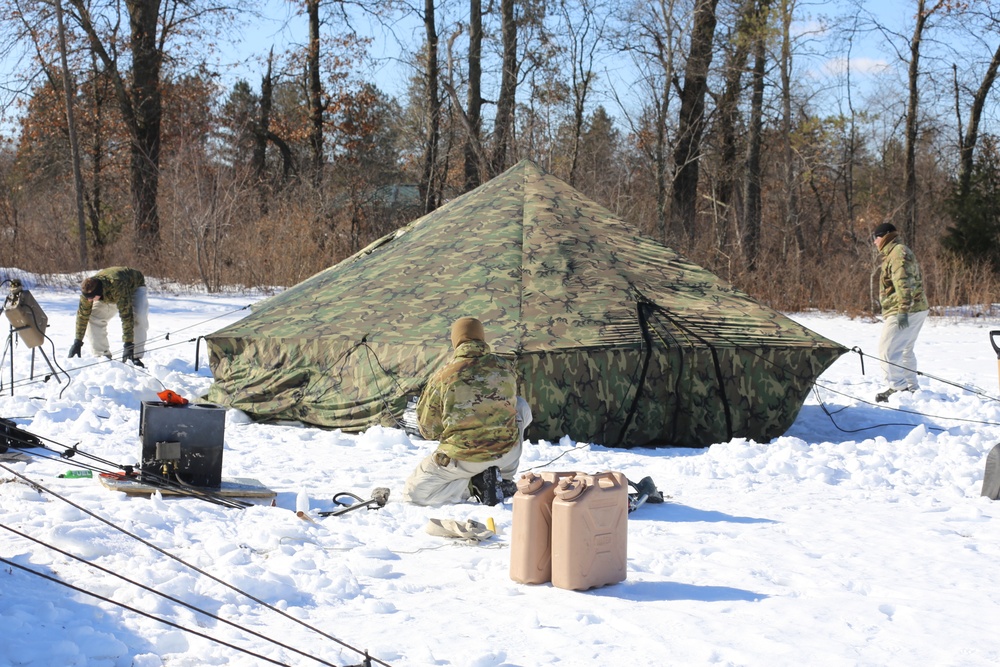 Cold-Weather Operations Course students practice building Arctic tent