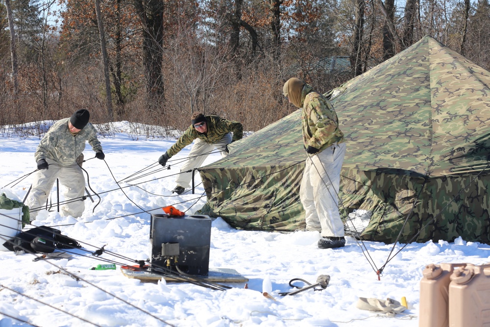 Cold-Weather Operations Course students practice building Arctic tent