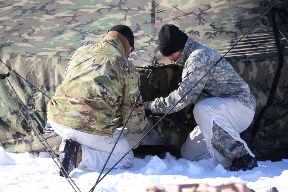 Cold-Weather Operations Course students practice building Arctic tent