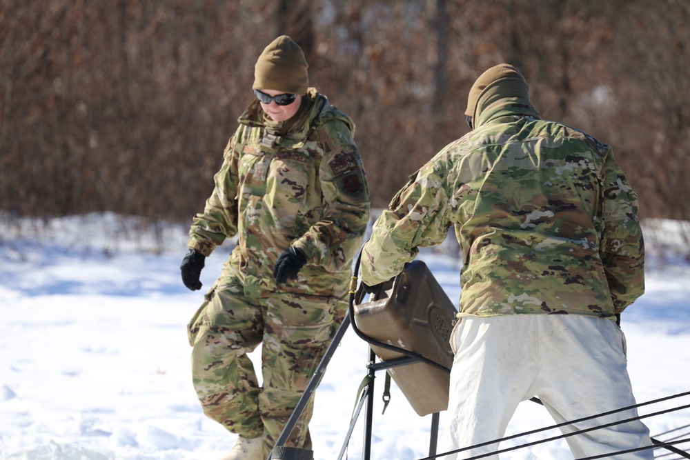 Cold-Weather Operations Course students practice building Arctic tent