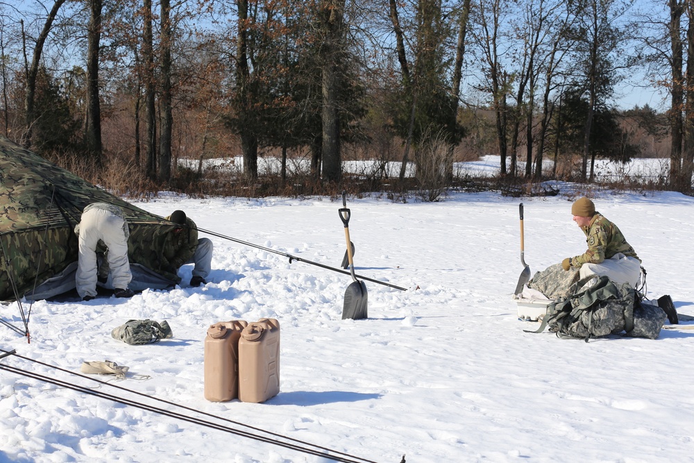 Cold-Weather Operations Course students practice building Arctic tent