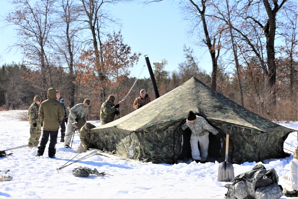 Cold-Weather Operations Course students practice building Arctic tent