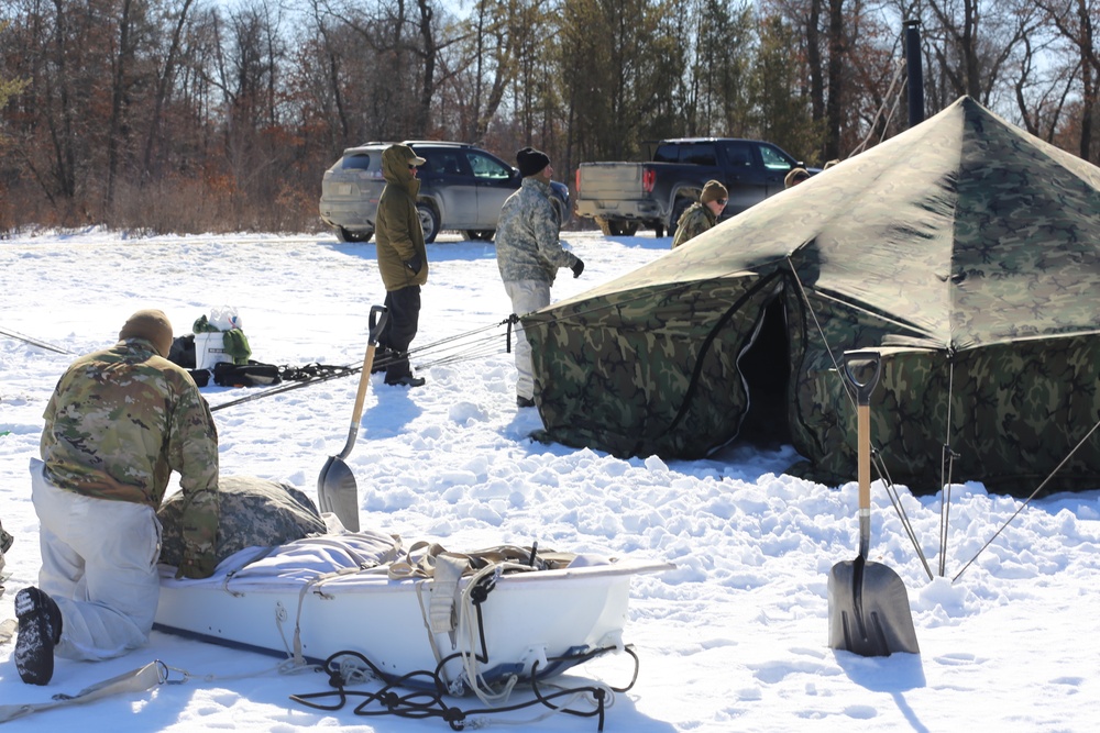 Cold-Weather Operations Course students practice building Arctic tent