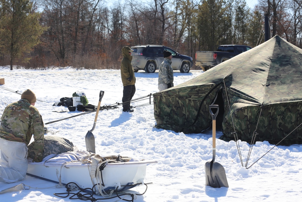 Cold-Weather Operations Course students practice building Arctic tent