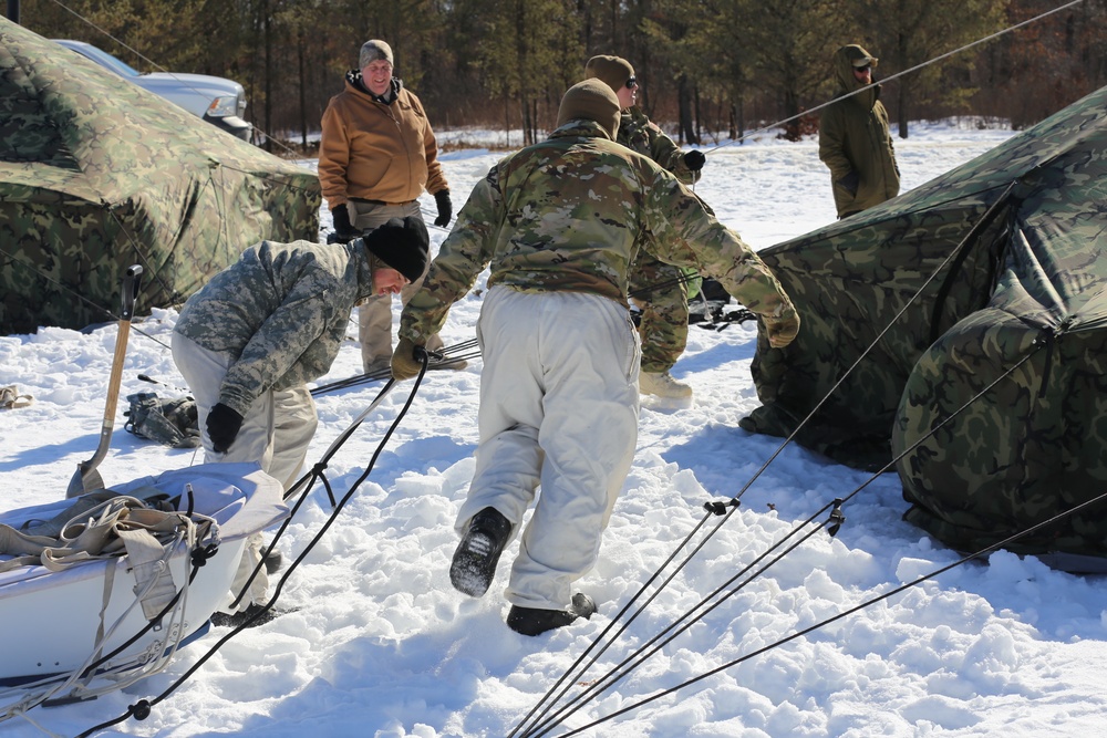 Cold-Weather Operations Course students practice building Arctic tent