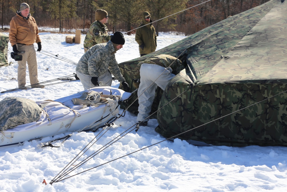 Cold-Weather Operations Course students practice building Arctic tent