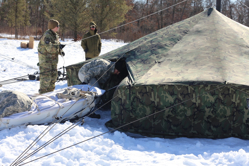 Cold-Weather Operations Course students practice building Arctic tent