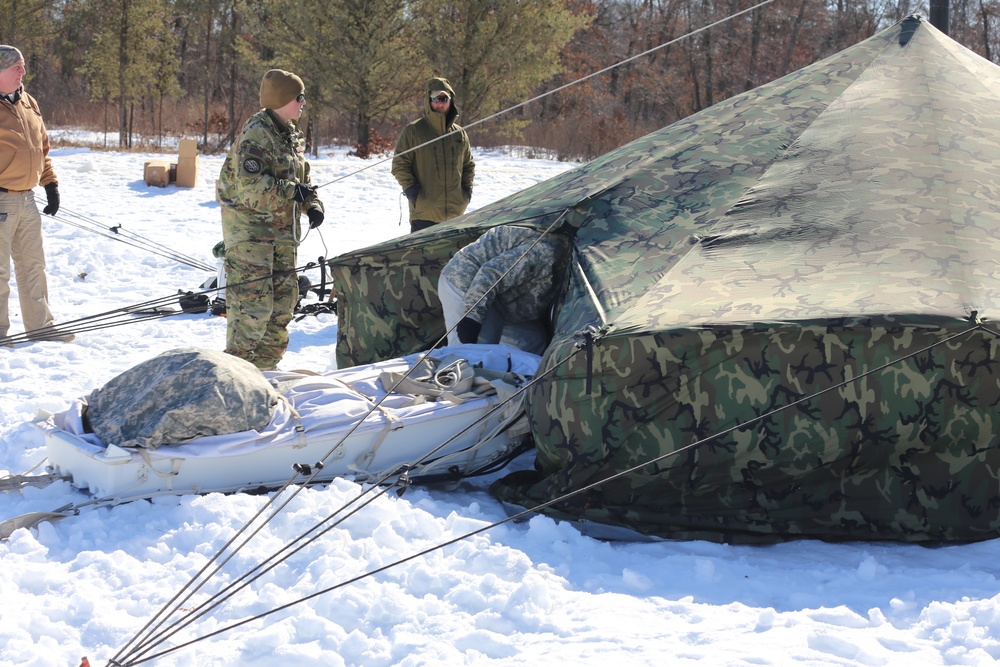 Cold-Weather Operations Course students practice building Arctic tent