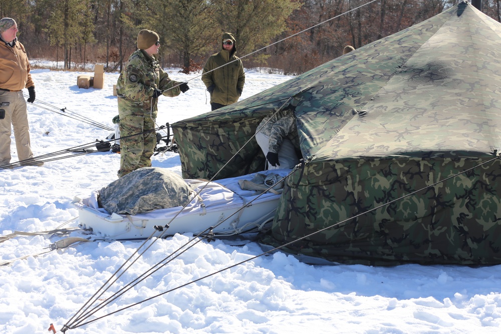 Cold-Weather Operations Course students practice building Arctic tent