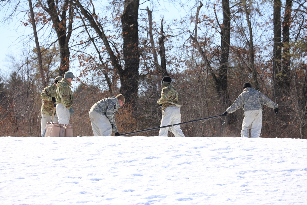 Cold-Weather Operations Course students practice building Arctic tent