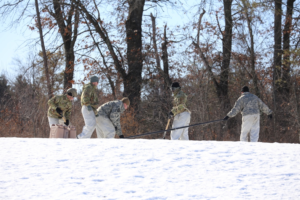 Cold-Weather Operations Course students practice building Arctic tent