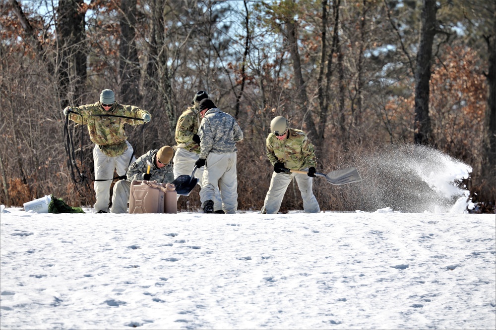 Cold-Weather Operations Course students practice building Arctic tent