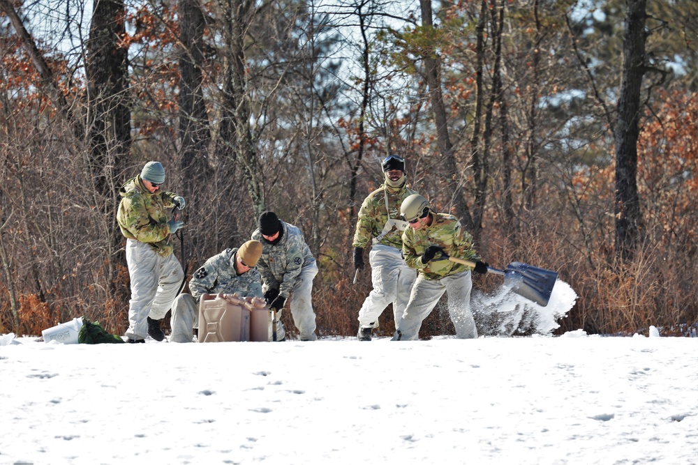 Cold-Weather Operations Course students practice building Arctic tent