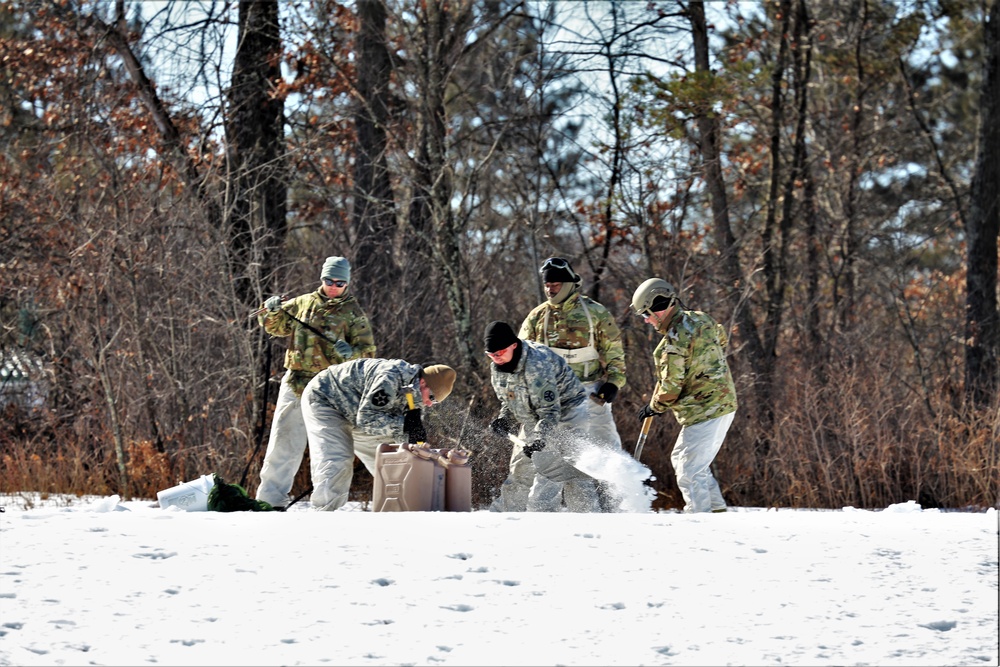 Cold-Weather Operations Course students practice building Arctic tent