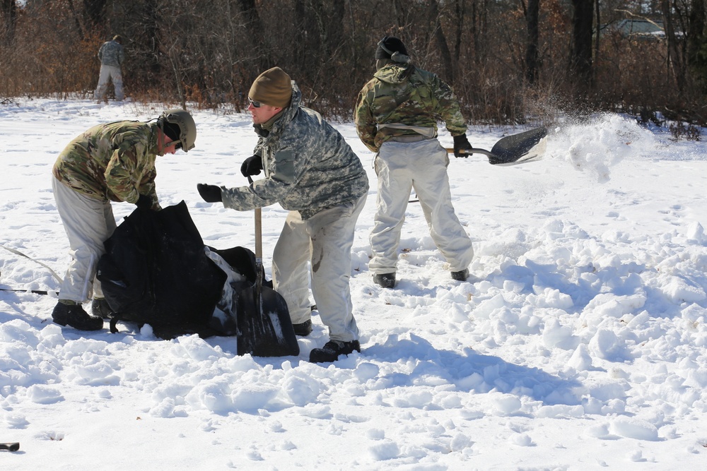 Cold-Weather Operations Course students practice building Arctic tent