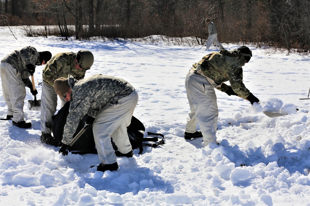 Cold-Weather Operations Course students practice building Arctic tent