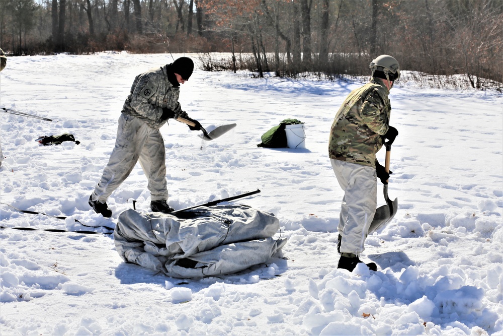 Cold-Weather Operations Course students practice building Arctic tent