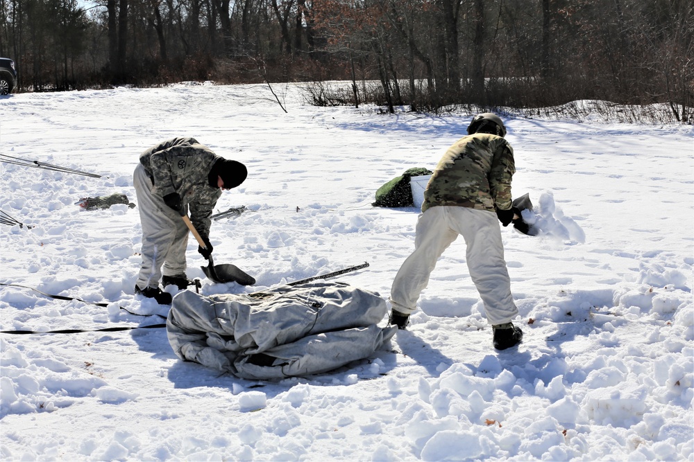 Cold-Weather Operations Course students practice building Arctic tent