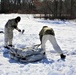 Cold-Weather Operations Course students practice building Arctic tent