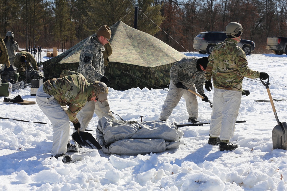 Cold-Weather Operations Course students practice building Arctic tent